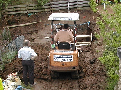 Digging a ramp down into the hole
